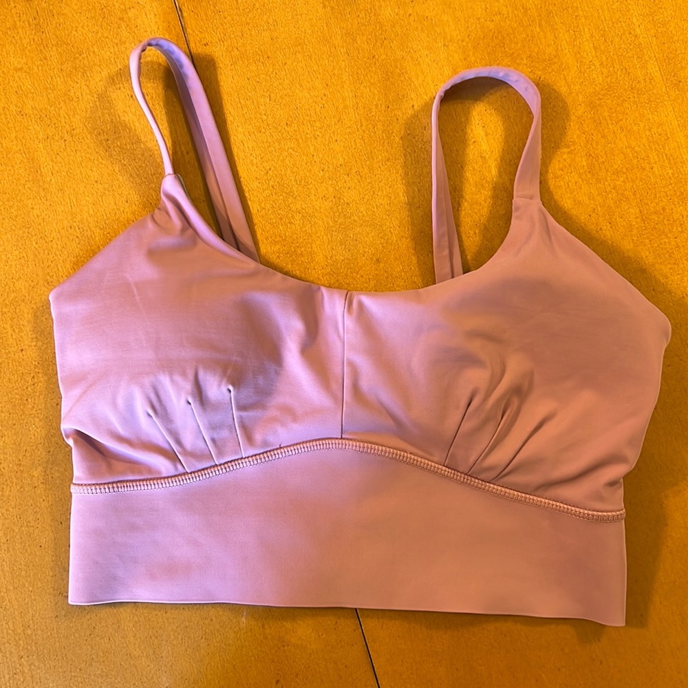 Born primitive “your go to sports bra” size M (runs a little small)